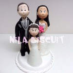 Miniatura personalizada dos noivos com 1 criança