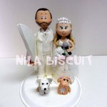 Bonecos do bolo de casamento com noivo surfista