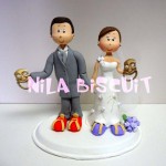 Bonecos do bolo de casamento com noivos atores