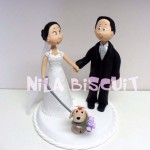 Bonequinhos do bolo de casamento com cachorro na coleira